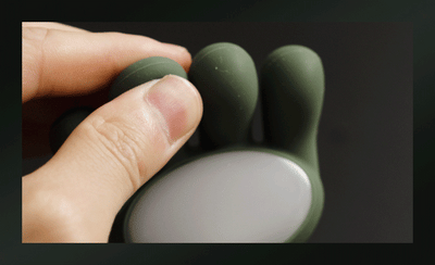 Hand using the MassageMate Pro™ device, showcasing its ergonomic design for effective massage therapy.